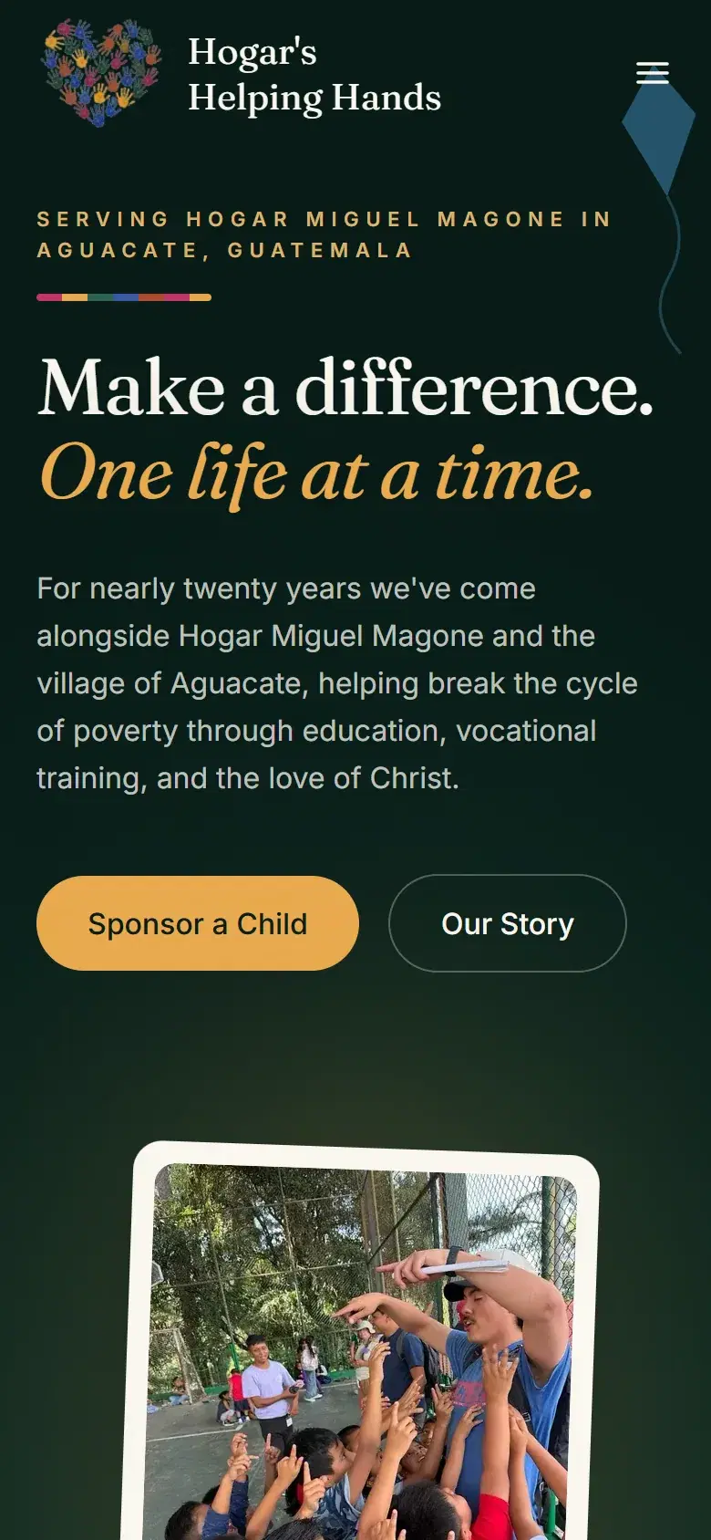 The Hogar’s Helping Hands homepage on a phone, with Sponsor a Child and Our Story buttons
