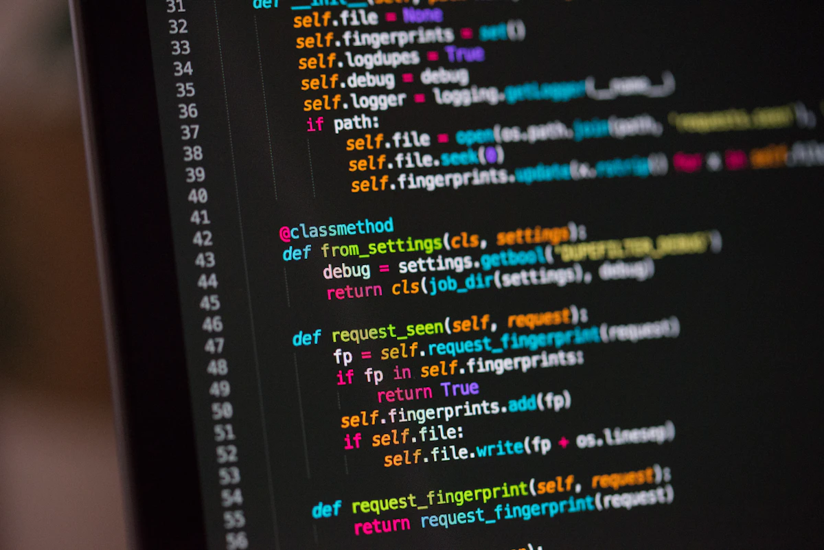 Close-up of website code on a monitor, the markup layer AI systems parse